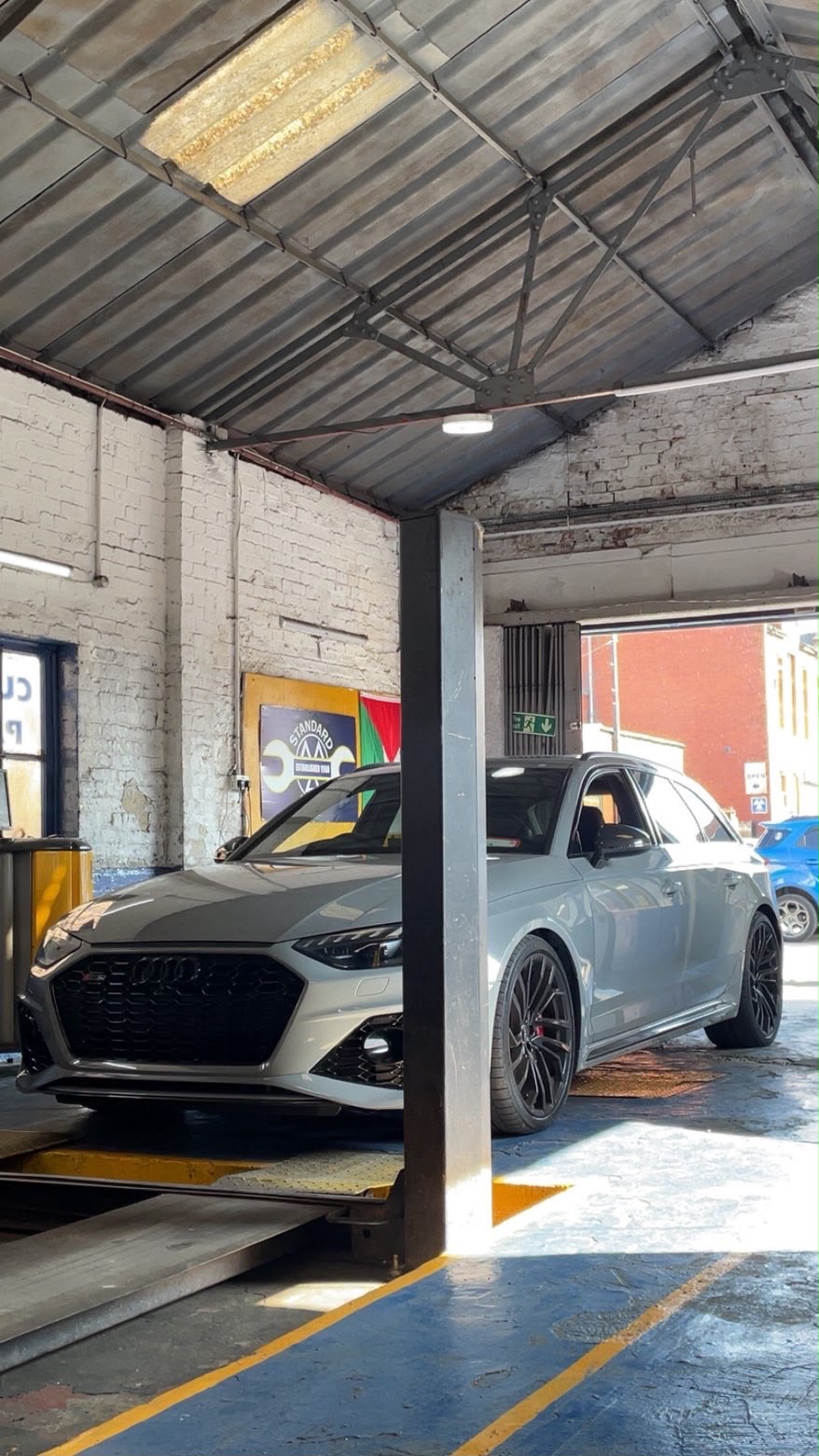Audi RS4 being MOT tested on the ramp at Standard Motors