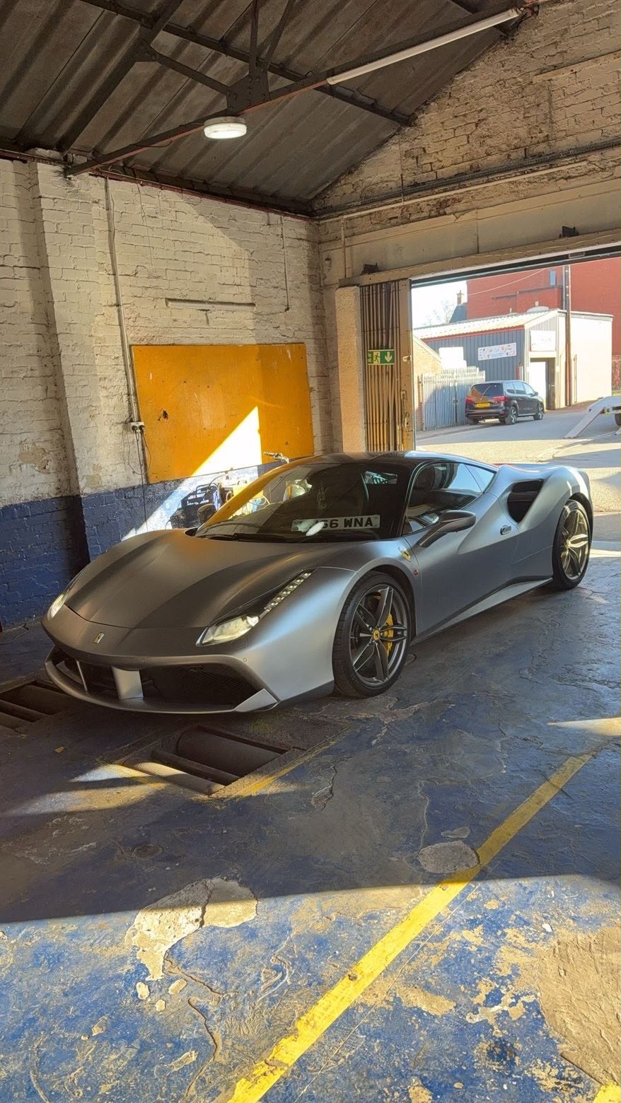 Ferrari 488 on the MOT ramp at Standard Motors, Farnworth